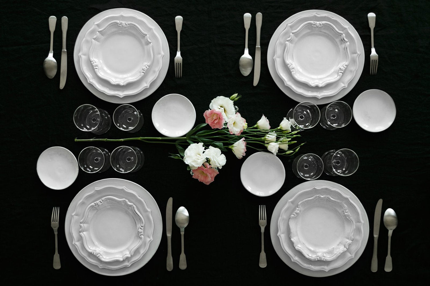 A table set à la française with handmade white CARRON earthenware, seen from above