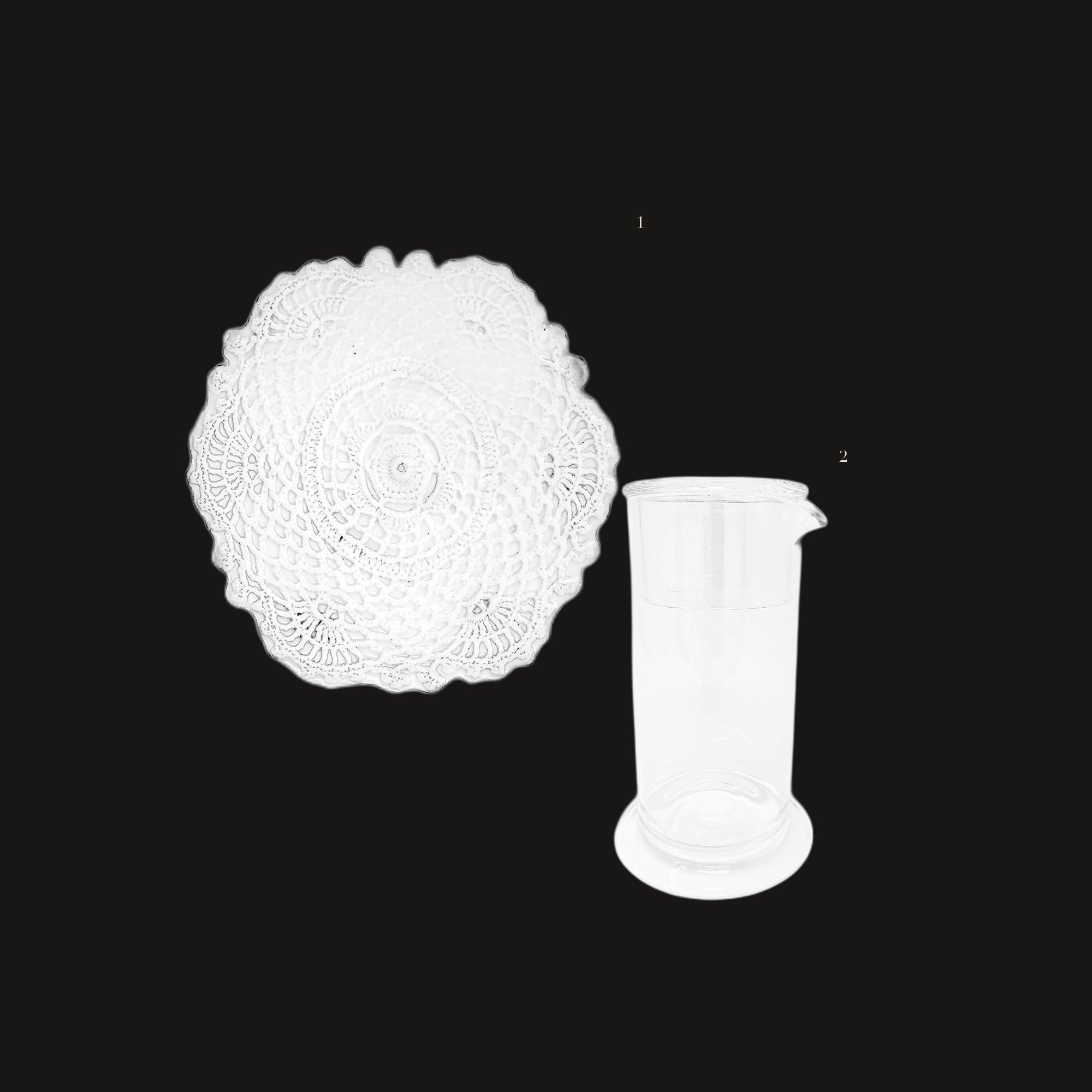 Bedside Carafe Set - the set laid out on black, each piece numbered