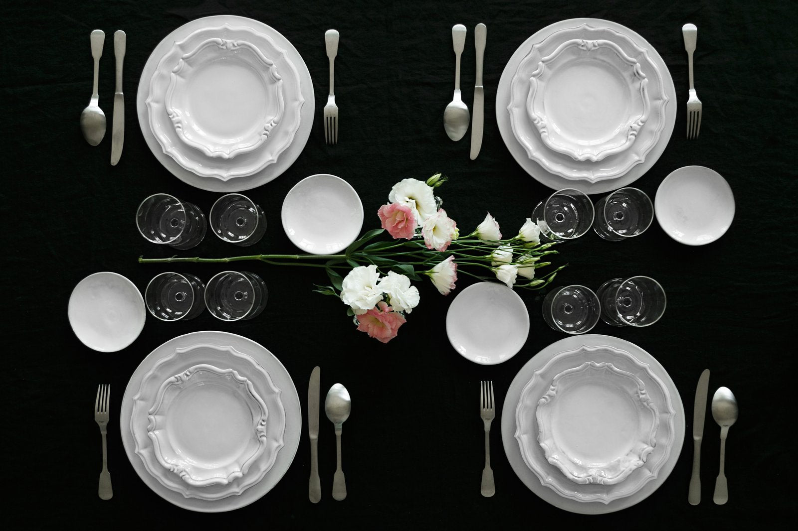 A table set à la française with handmade white CARRON earthenware, seen from above