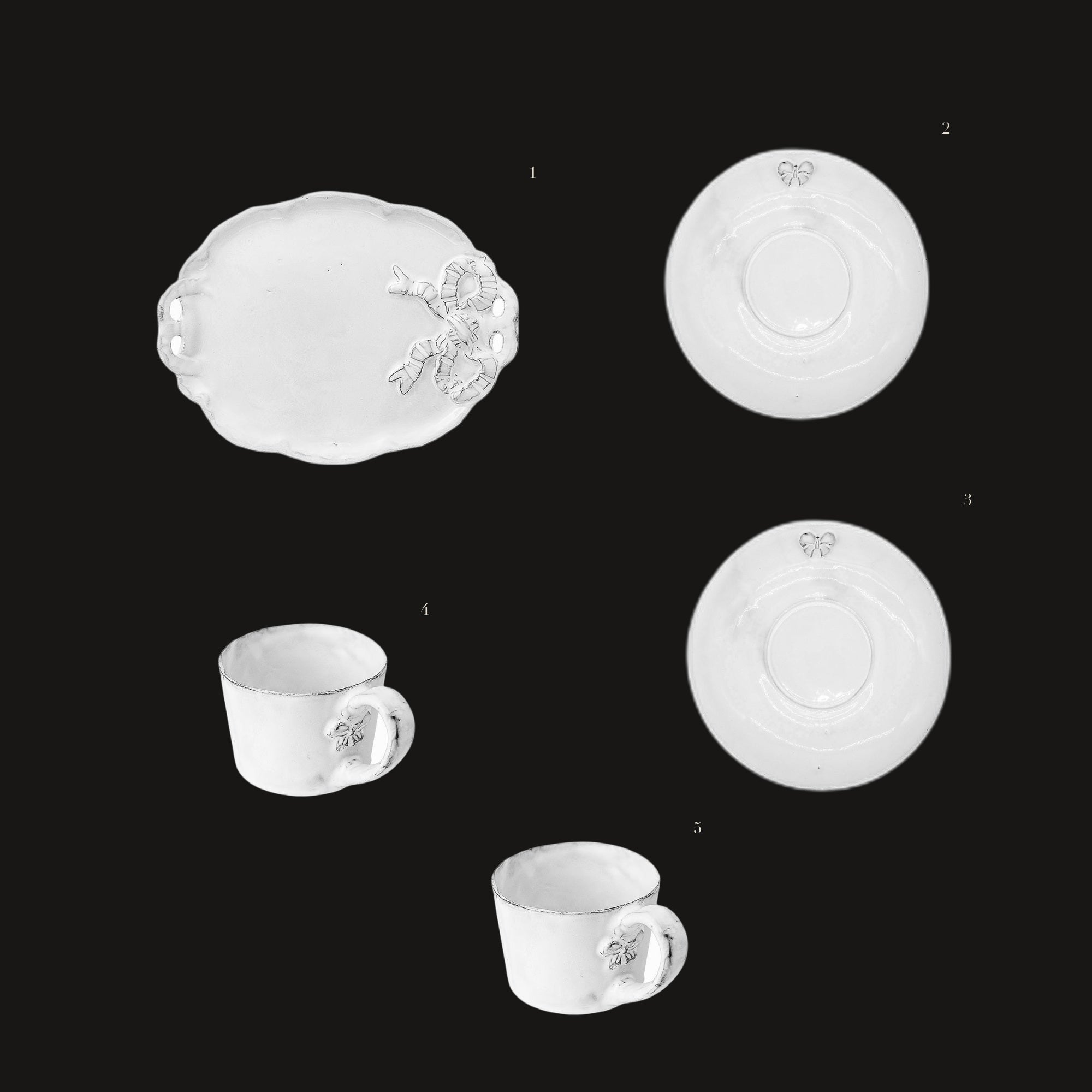Marie-Antoinette Tea Set - the set laid out on black, each piece numbered